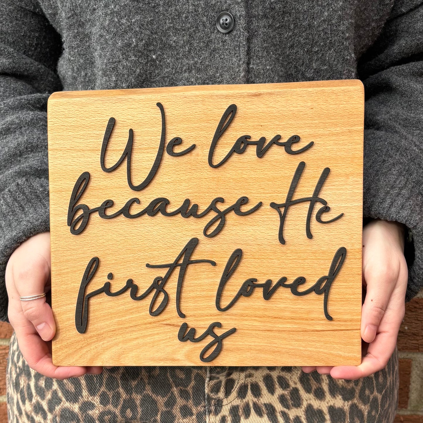 'We love because He first loved us' decorative beech plaque
