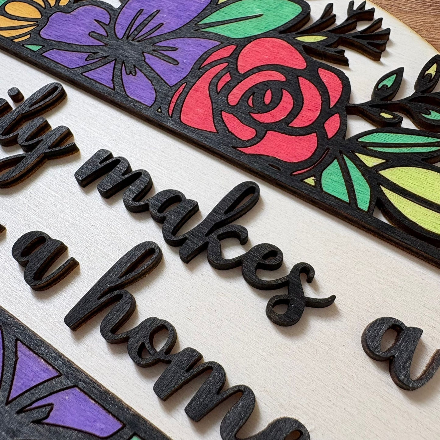 ‘Family makes a house a home' - wooden hanging plaque