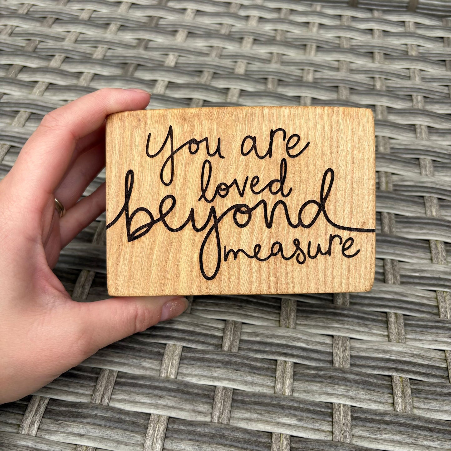 'You are loved beyond measure' decorative plaque