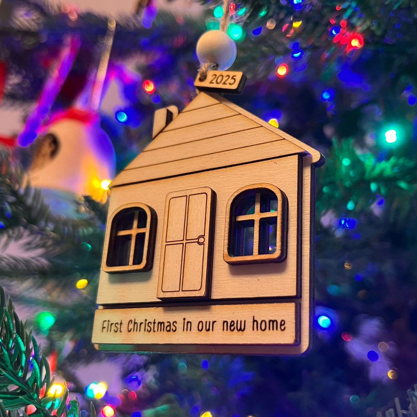 ❆ 'First Christmas in our new home' wooden Christmas bauble