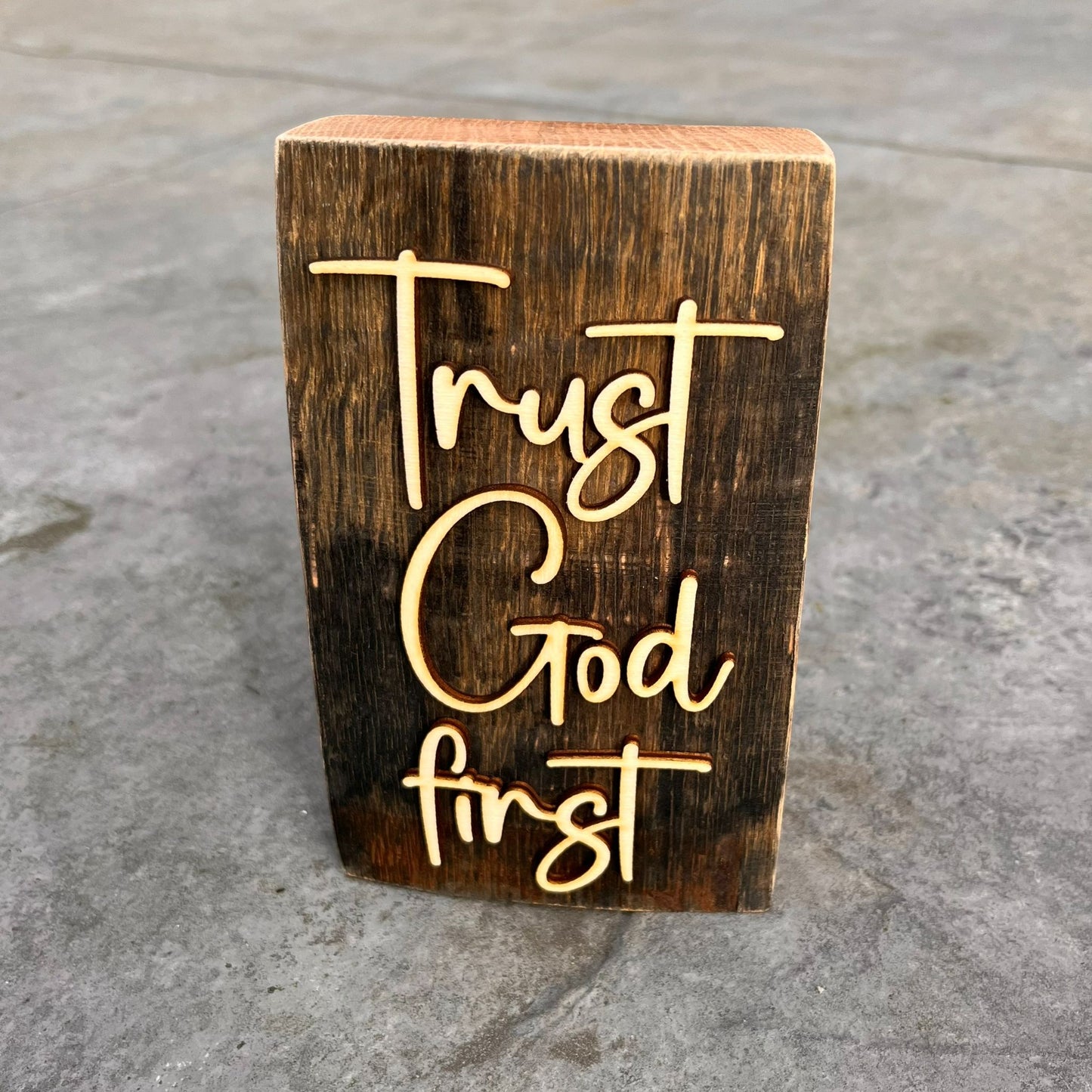 'Trust God first' rustic wooden plaque
