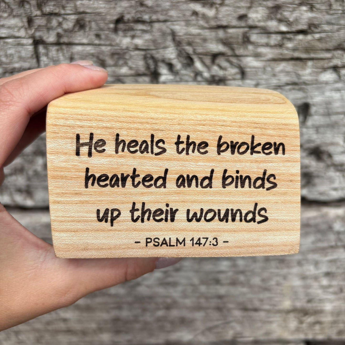 'He heals the broken hearted' laser engraved live edge plaque