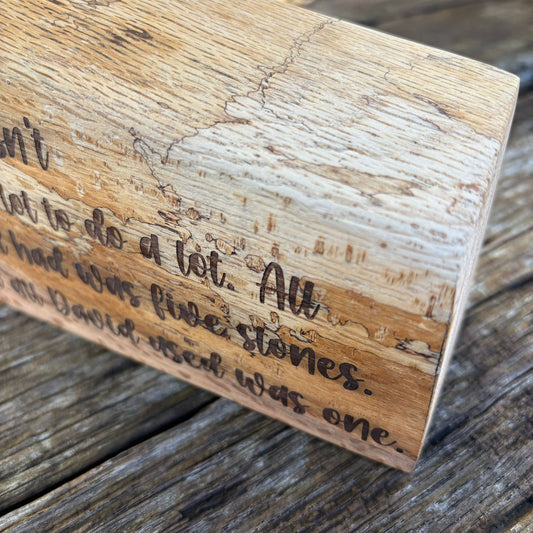 'God doesn't need a lot' solid wood plaque