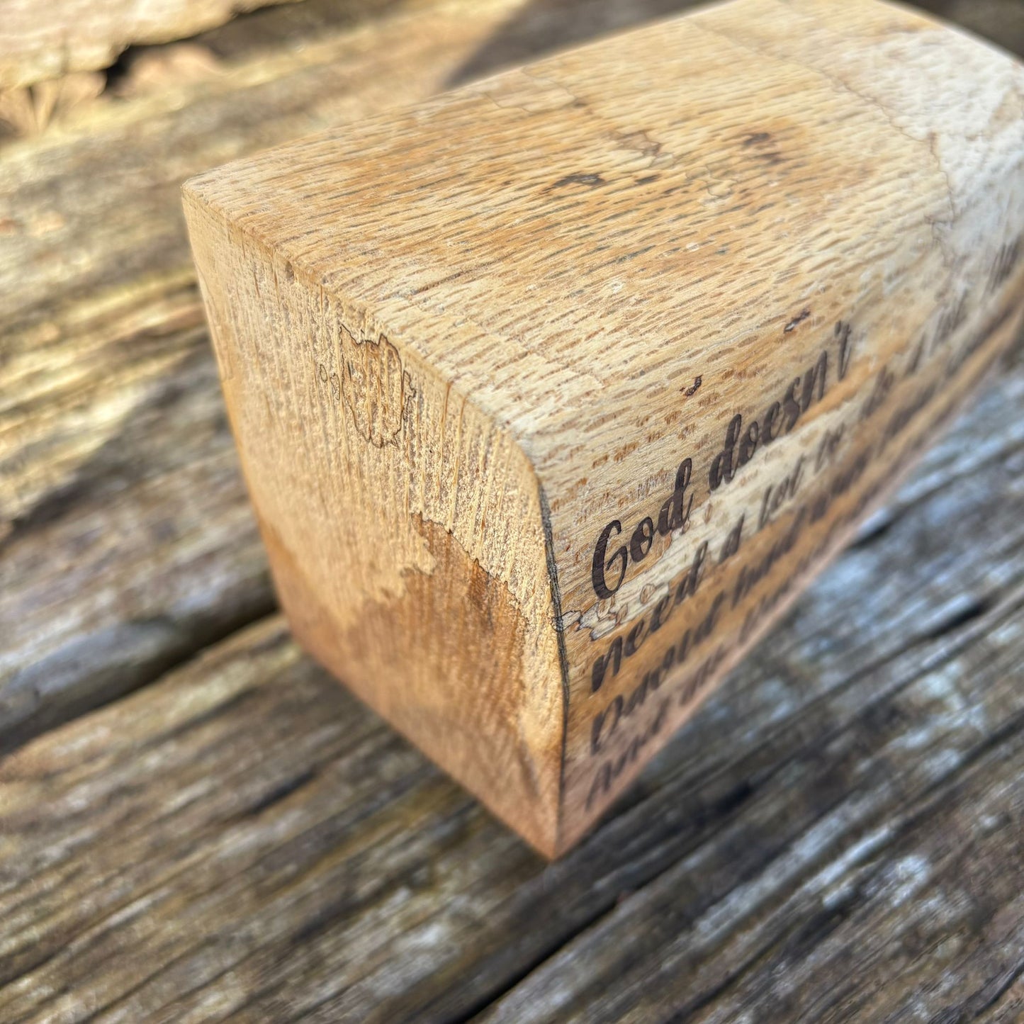 'God doesn't need a lot' solid wood plaque