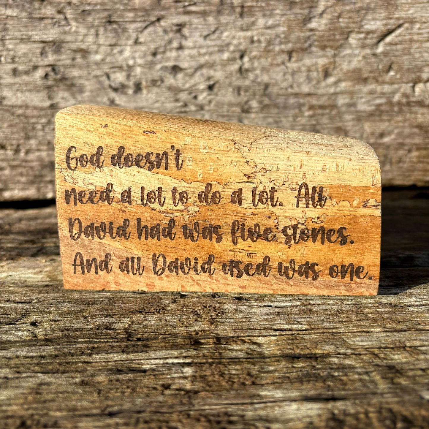 'God doesn't need a lot' solid wood plaque