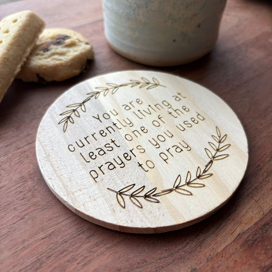 ‘Living your prayers' wooden coaster