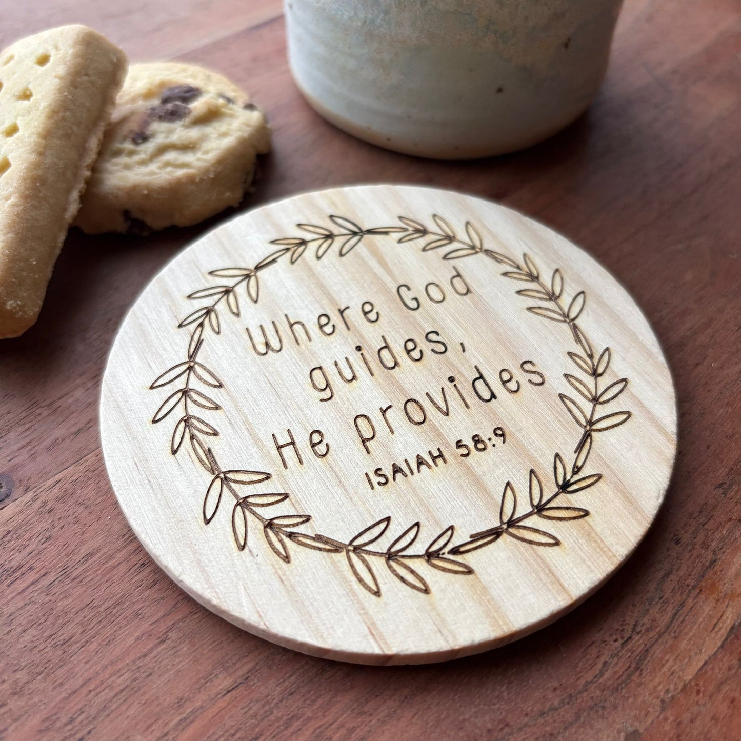 'Where God guides, He provides' wooden coaster