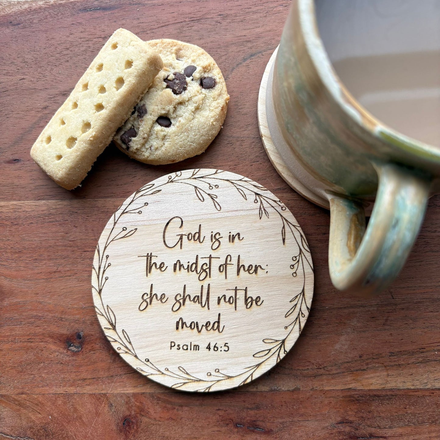 ‘God is in the midst of her' wooden coaster