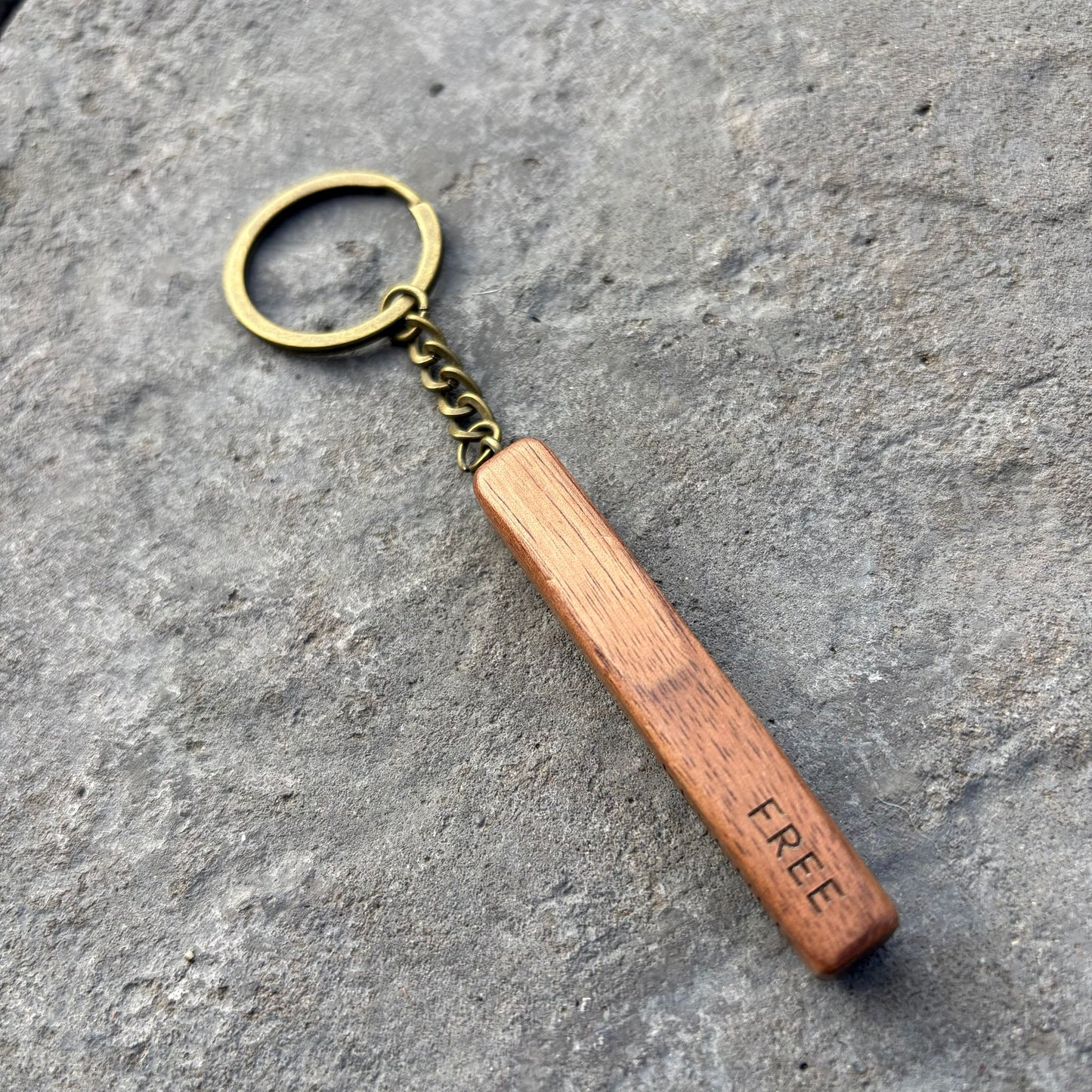 'Rescued, redeemed, forgiven, free' walnut bar keyring
