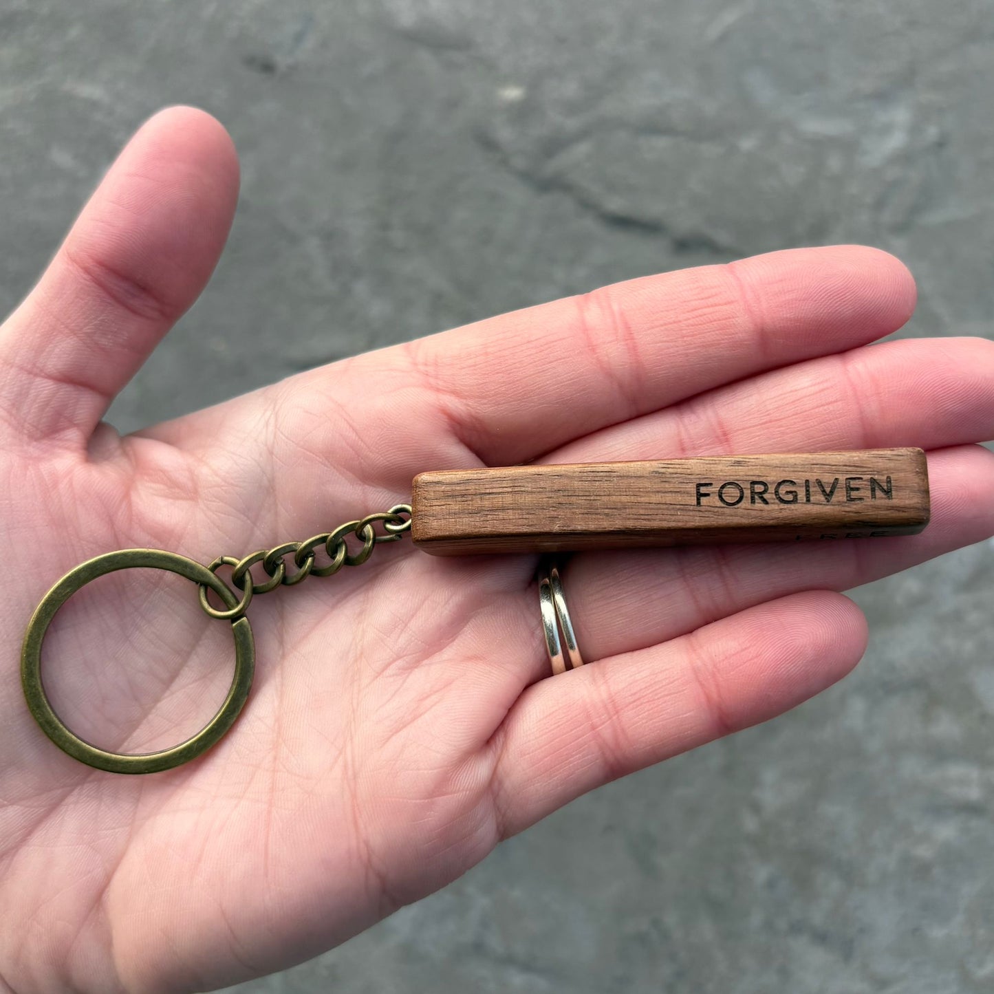 'Rescued, redeemed, forgiven, free' walnut bar keyring