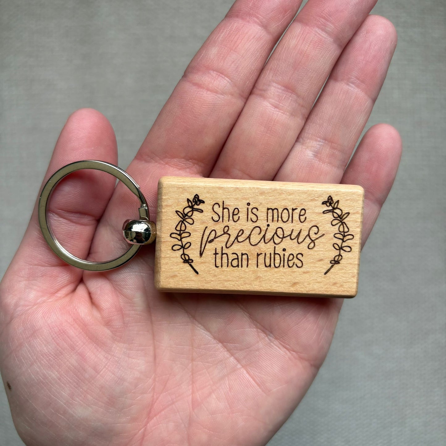 'She is more precious than rubies' wooden keyring