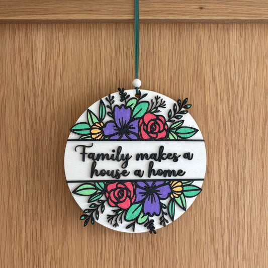 ‘Family makes a house a home' - wooden hanging plaque