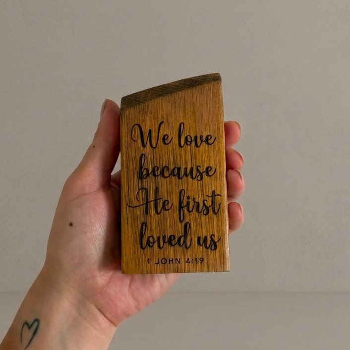 'We love because He first loved us' decorative white oak plaque